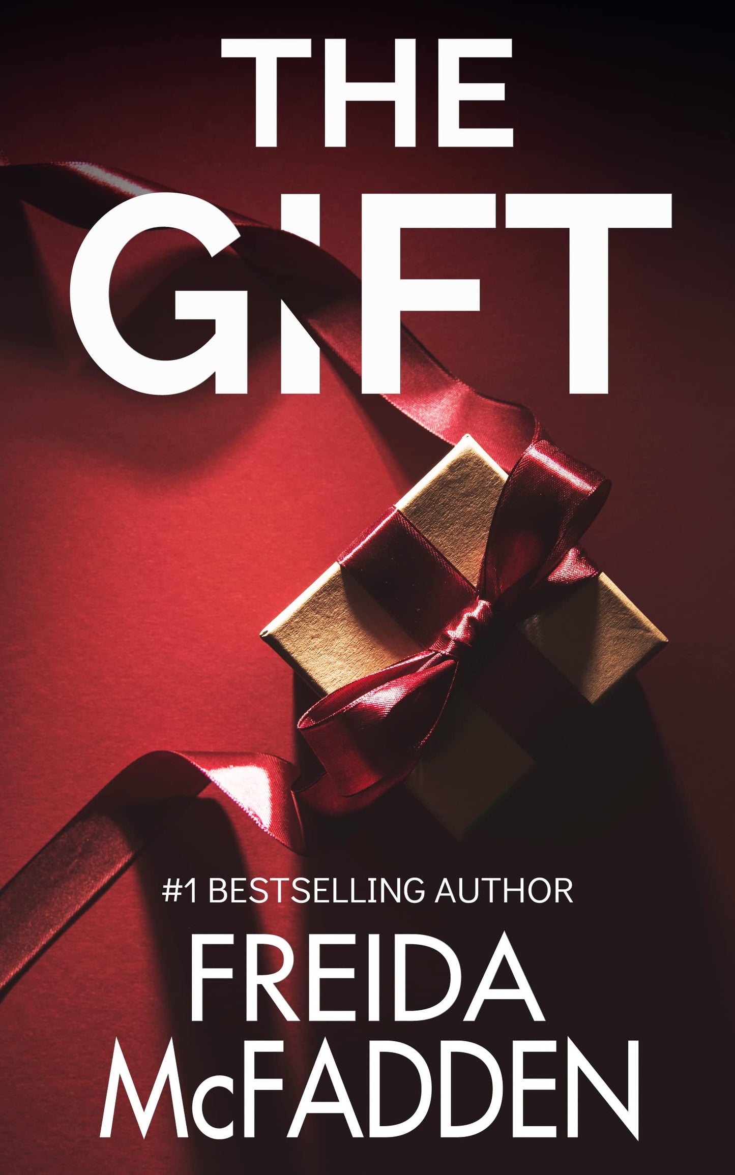 Book cover of 'The Gift' by Freida McFadden