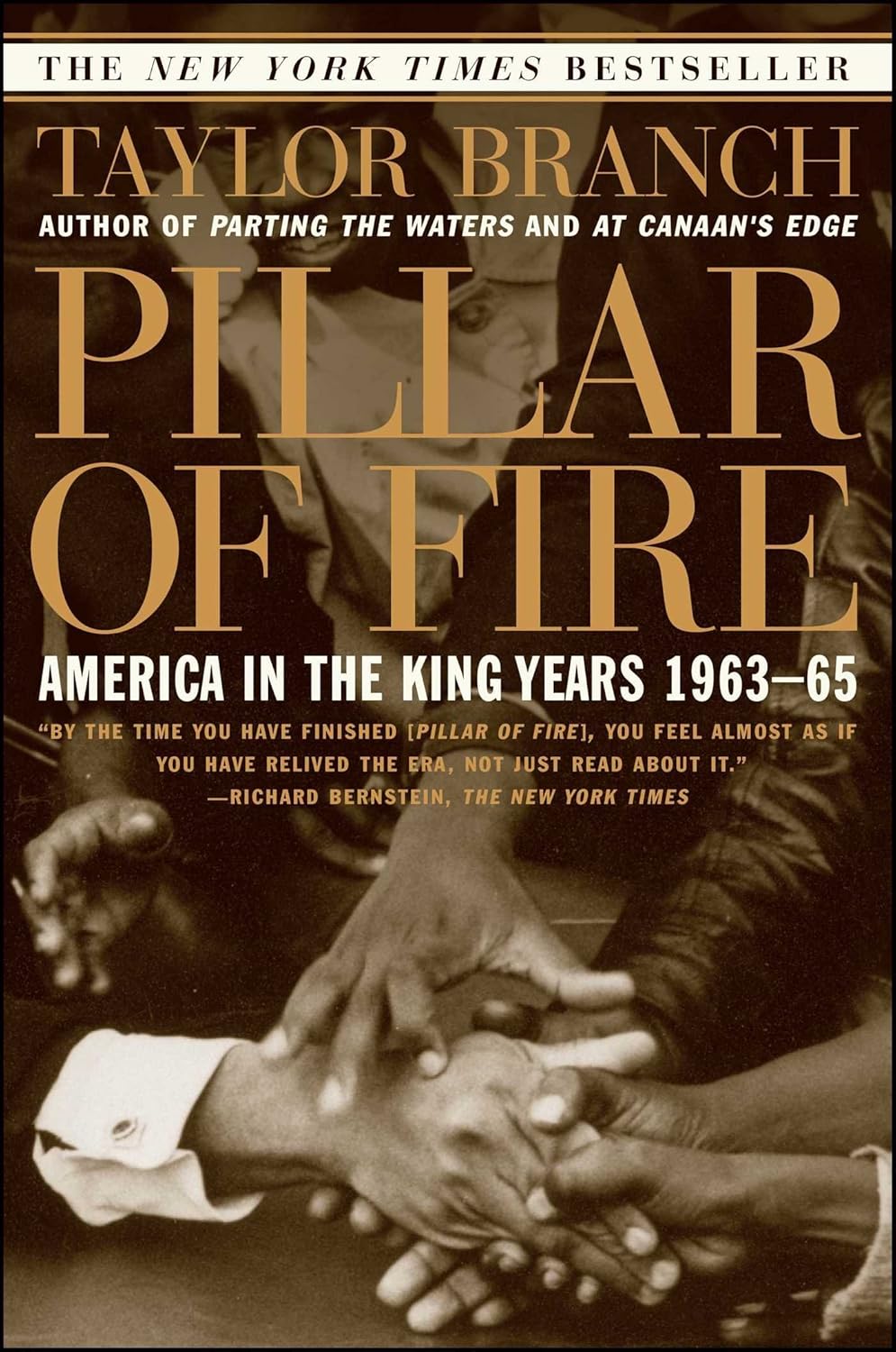 Book cover of 'Pillar of Fire' by Taylor Branch with a black and white photo of hands shaking.