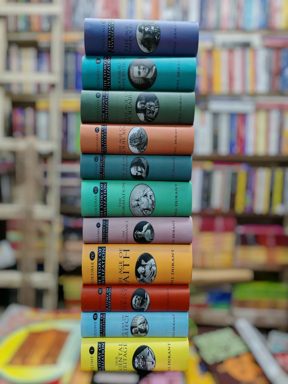Stack of books with colorful spines in a bookstore setting