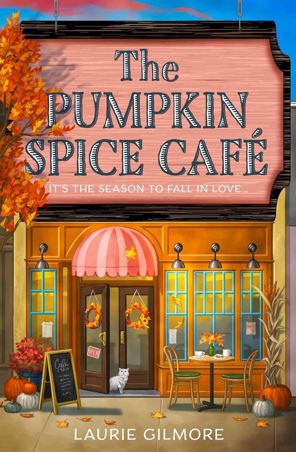 Book cover of 'The Pumpkin Spice Cafe' by Laurie Gilmore with a café 